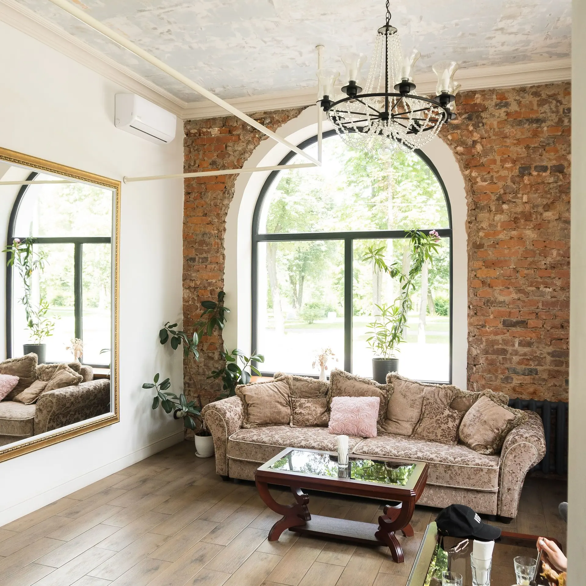 Wooden coffee table in front of a brown sofa
