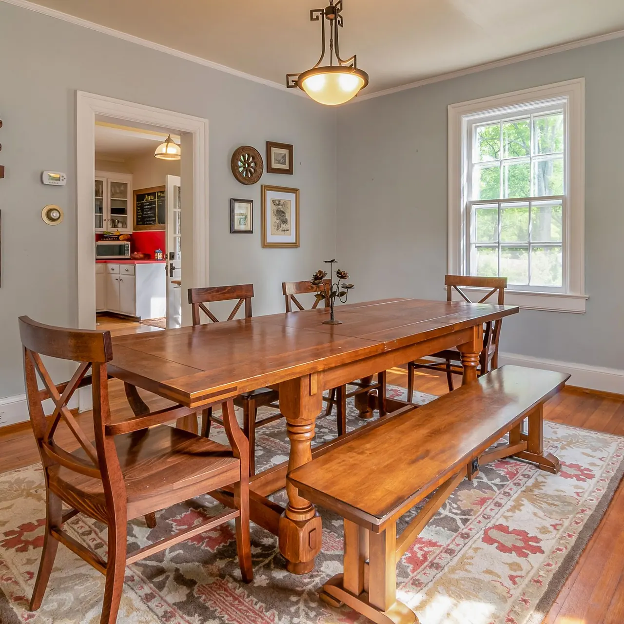 Wooden dining table with four matching chairs