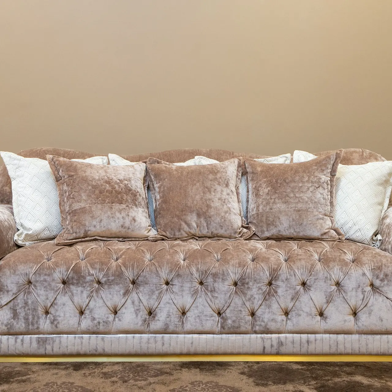 Brown cushioned three-seat sofa