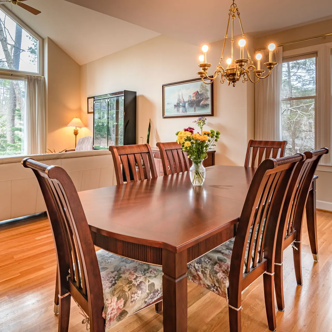 Solid wooden table beside a window
