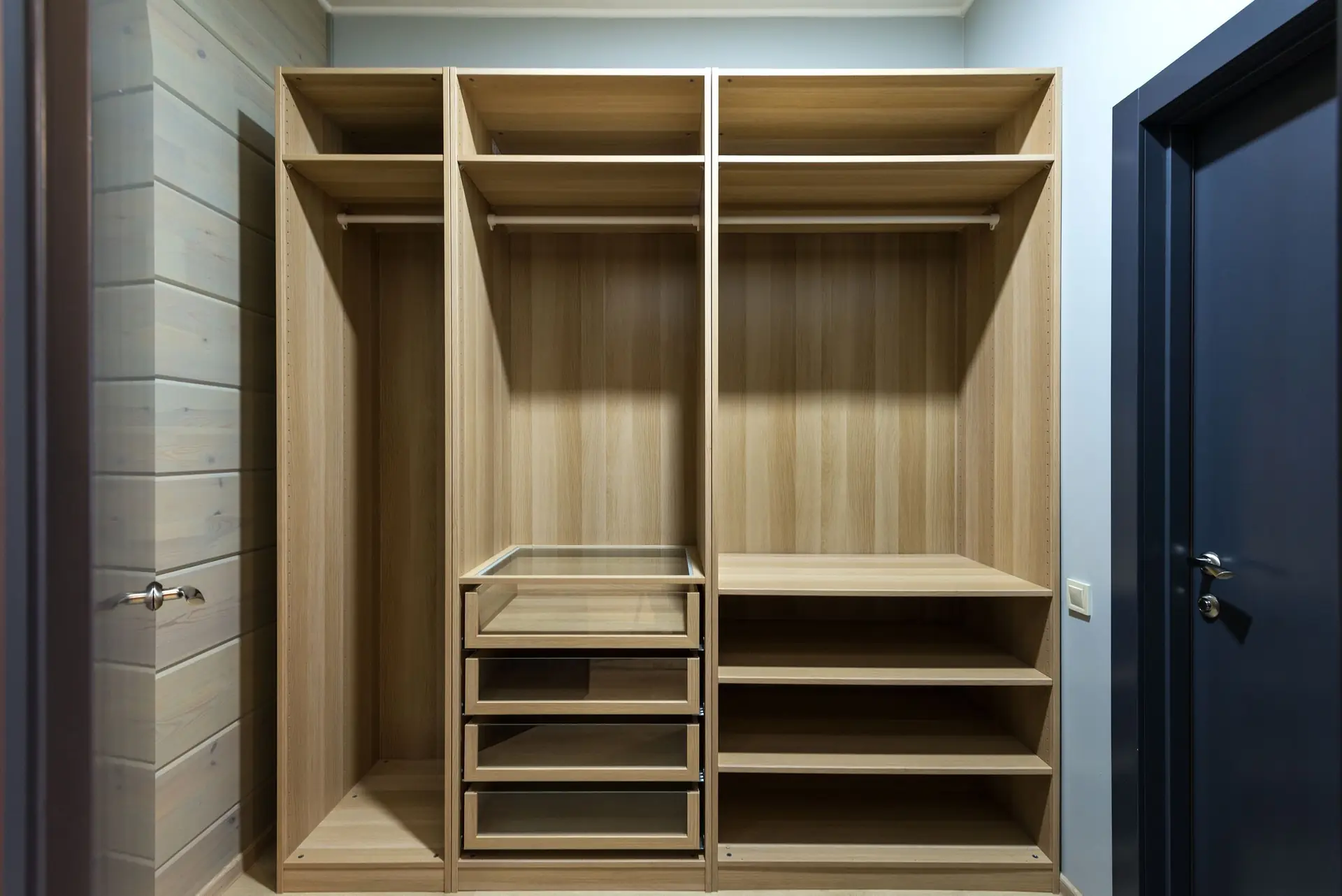 Wooden wardrobe shelving with folded storage