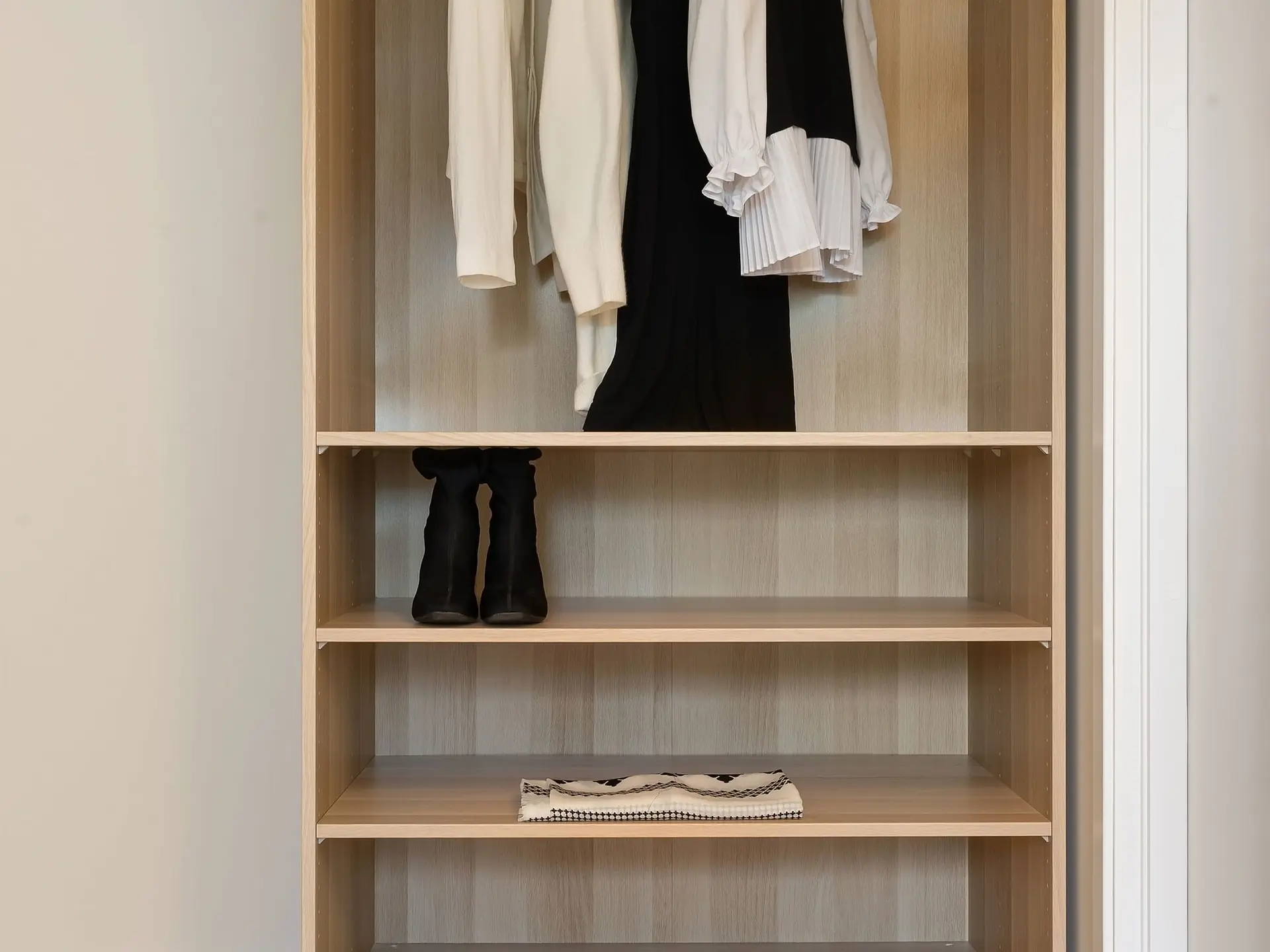 Freestanding wooden wardrobe in a bedroom