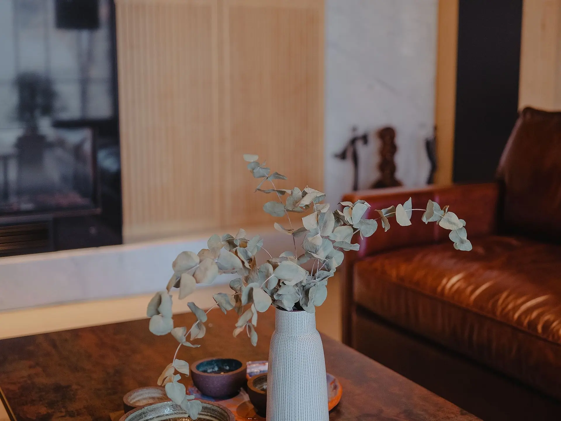 Coffee table styled with a vase and books