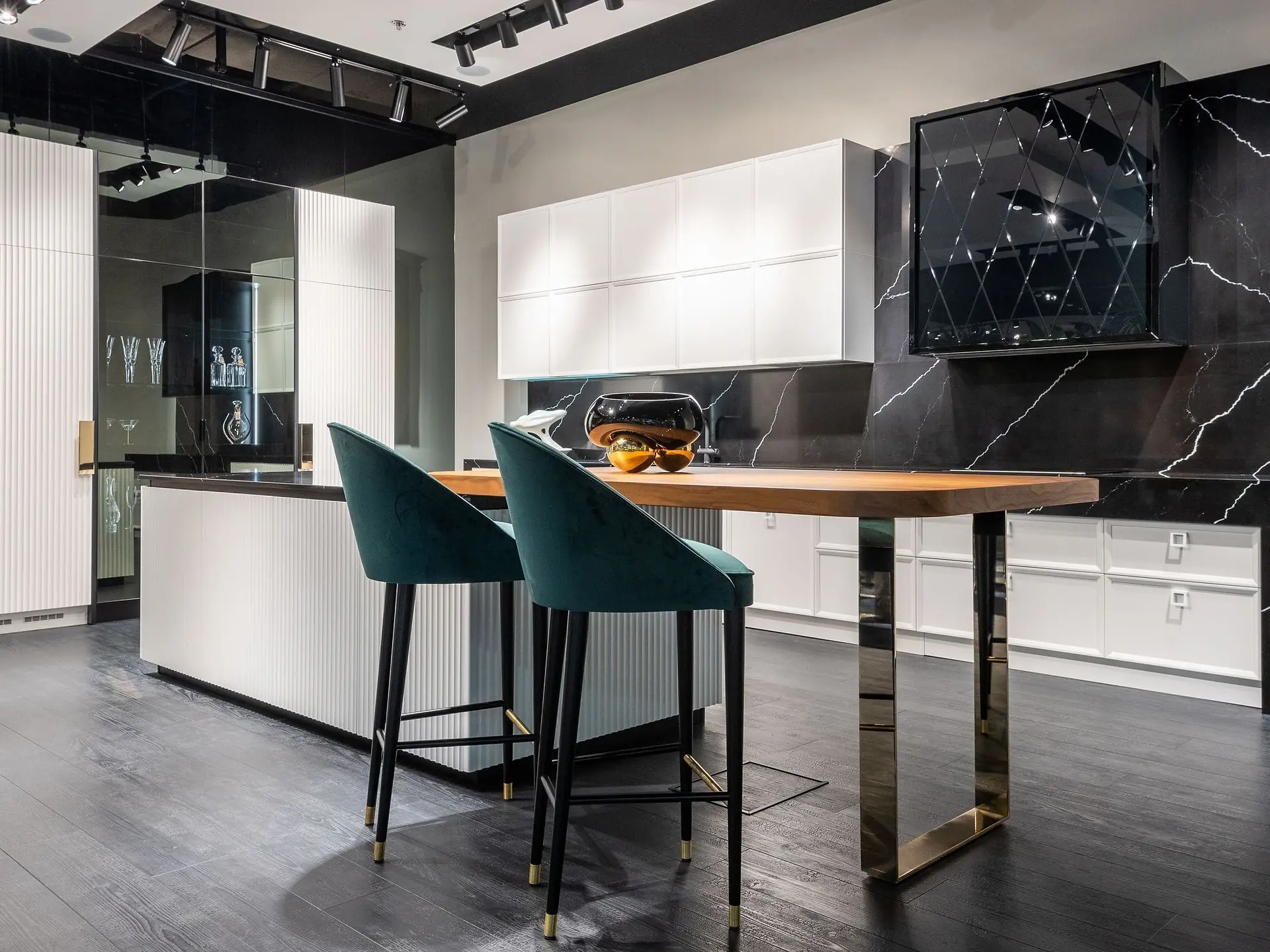 Black and white kitchen cabinetry in a modern flat