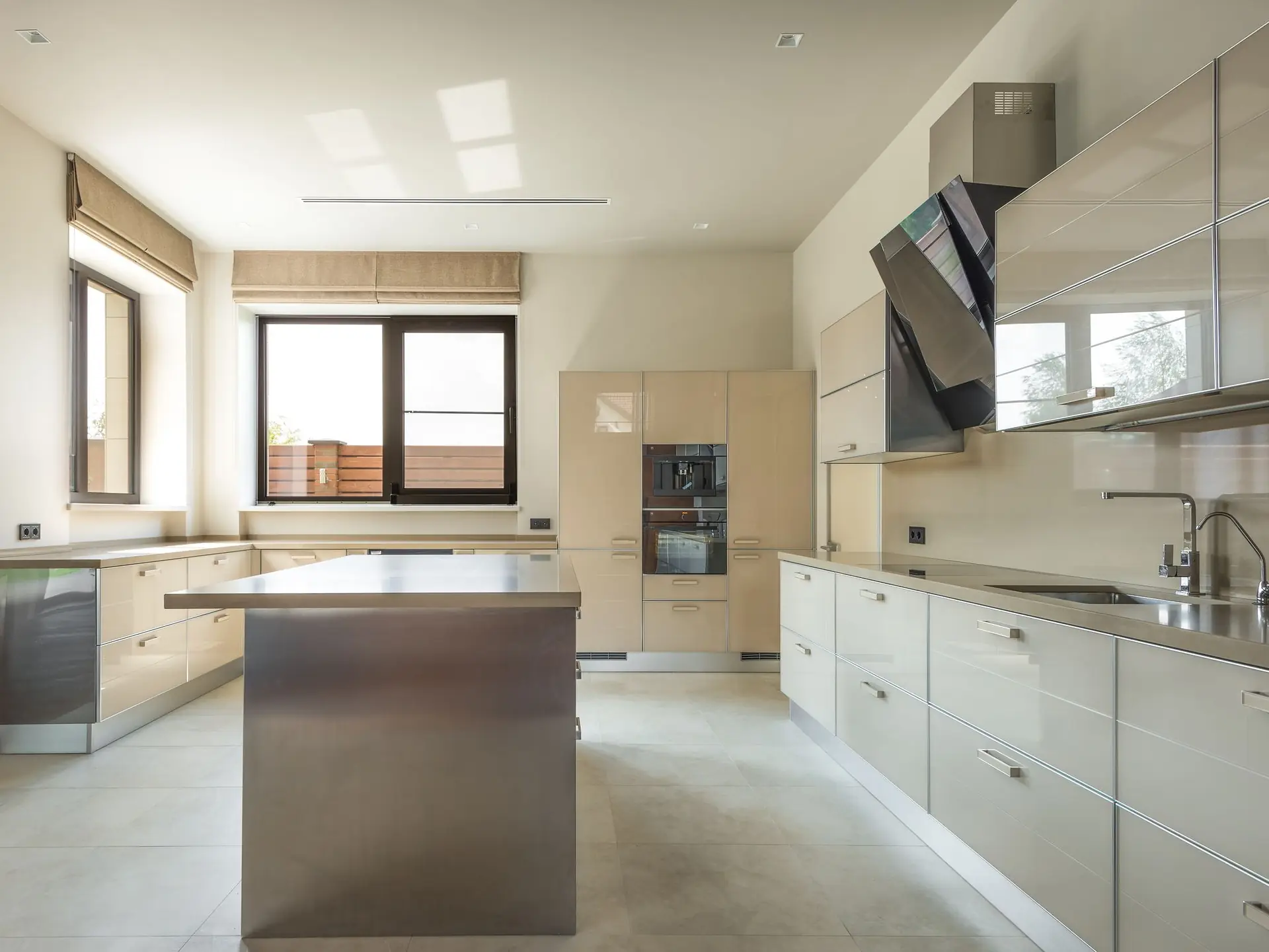 Kitchen cabinets beside a white kitchen island