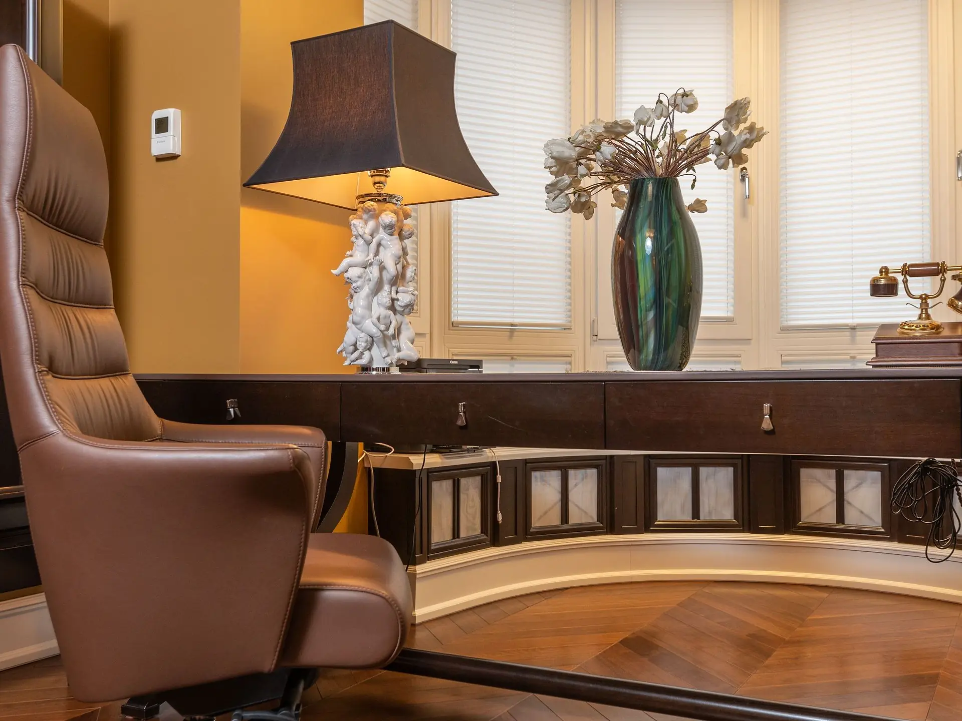 Wooden desk with a leather office chair