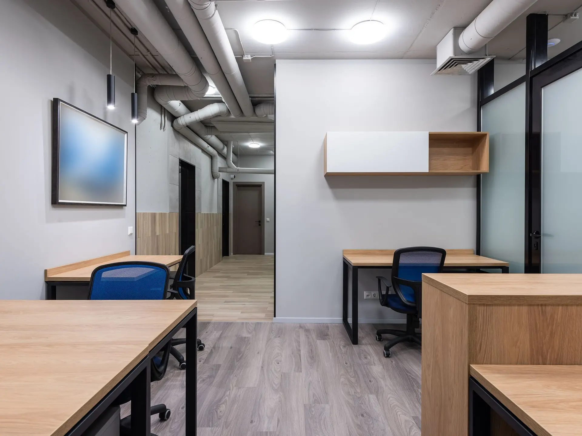 Office interior with desk, chair and shelving