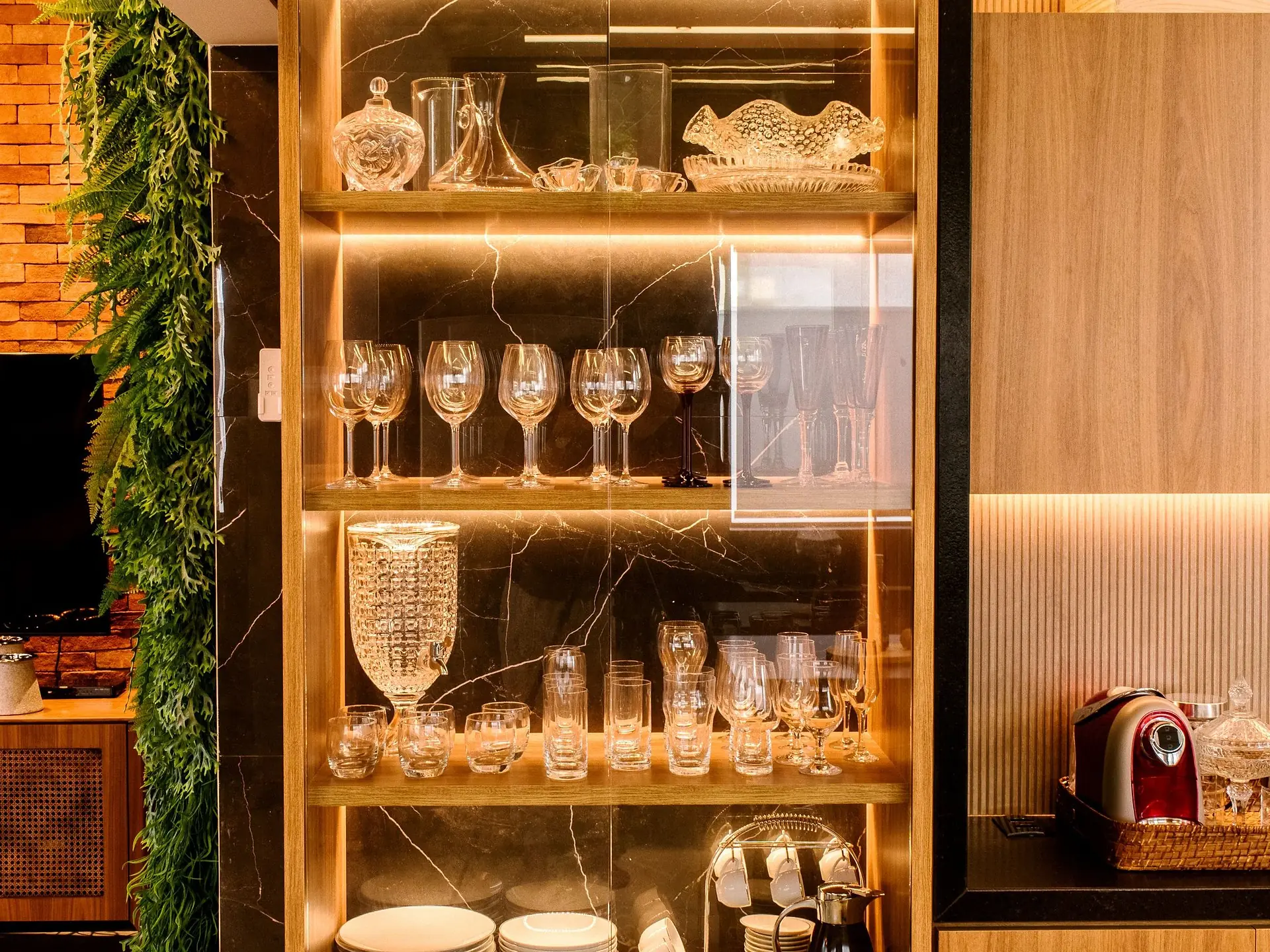 Illuminated glass display cabinet with shelving