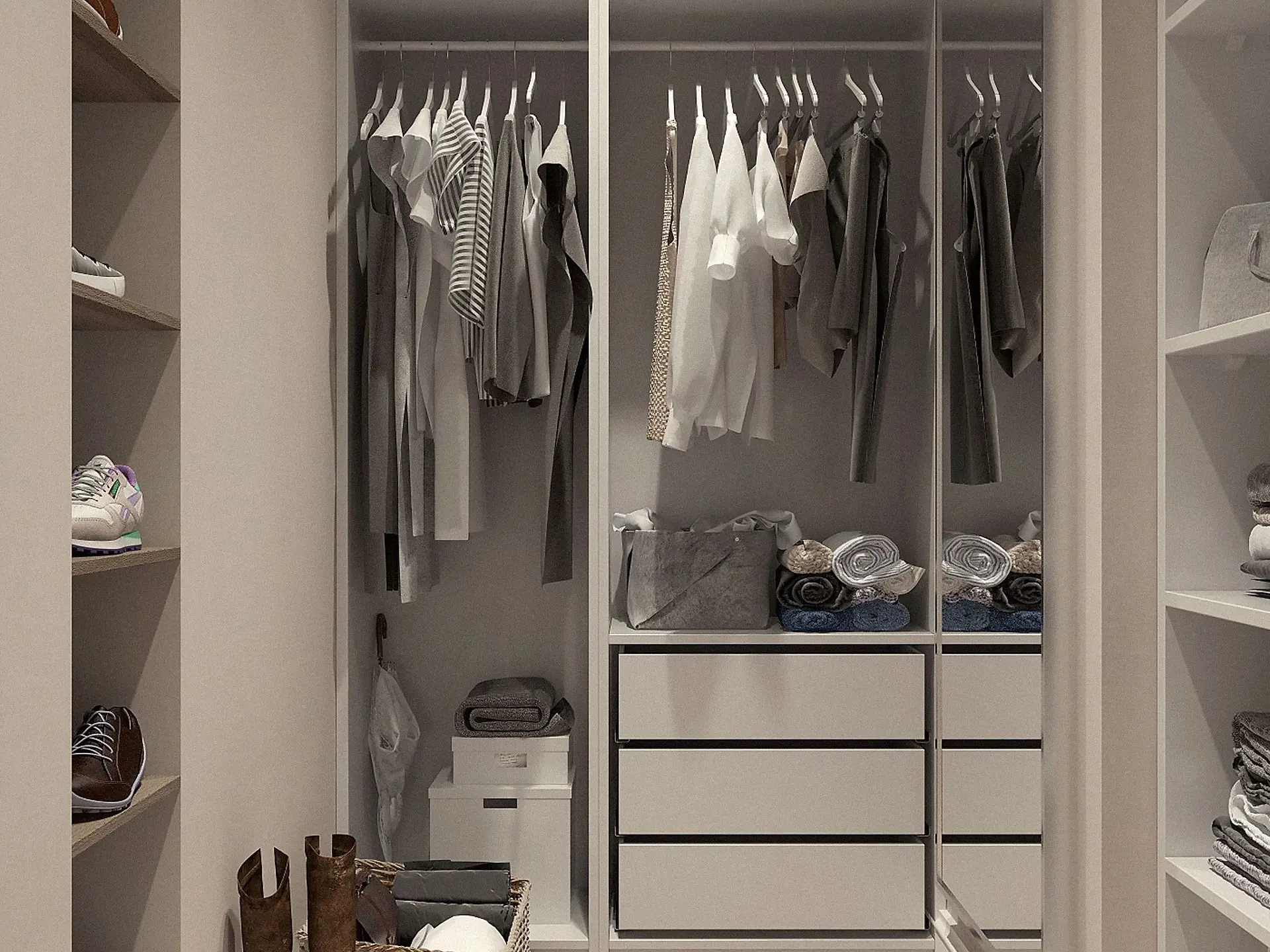Clothes hung inside a fitted wardrobe cabinet